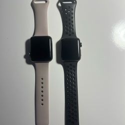 2 Apple Watches And Charger 