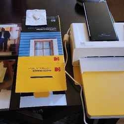 PRINT PICTURES DIRECTLY FROM YOUR PHONE WITH THE KODAK INSTANT 4PASS DOCK PRINTER.