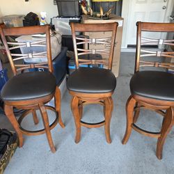 3 nice swivel bar stools in great condition - recent re-upholstered.