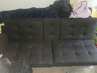 Black futon with center cup holder fold down