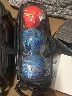 Totes with bowling balls inside