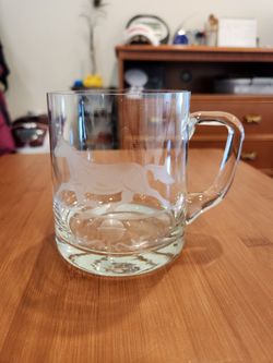 vintage etched glass beer mug with a running horse design, made of clear, heavy glass, good condition, 4.5 " tall 