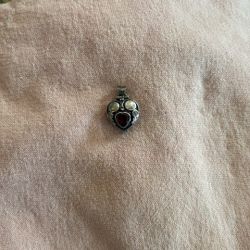 Sterling Silver And Garnet Charm