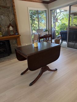 Antique drop leaf dining table