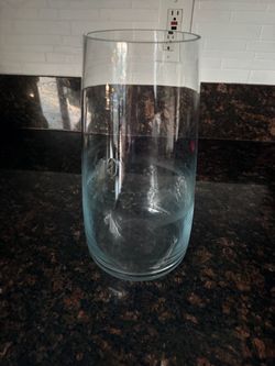 Glass vase compared to height of a Starbucks cup.