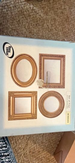 Decorative set of four gold mirrors.