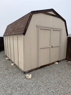 Wooden Storage Shed with Barn-Style Roof