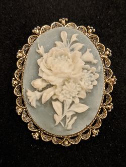 $35. Vintage 1960's Gerry's white Flower Brooch on a blue background. 2 inches long. 1.5 inch wide.
