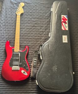 Squier 20th anniversary red Stratocaster with emgs, strap, and a case