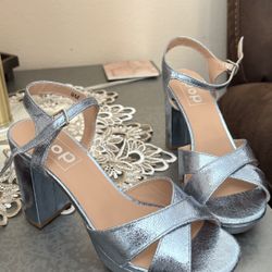 brand new, never Worn metalic blue heels. super cute! size 8
