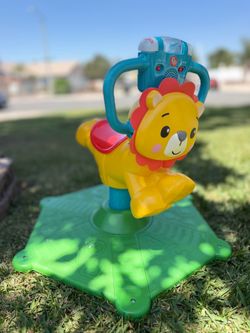 Fisher-Price Bounce & Spin Lion Stationary Ride-On Electronic Learning Toy for Toddlers
