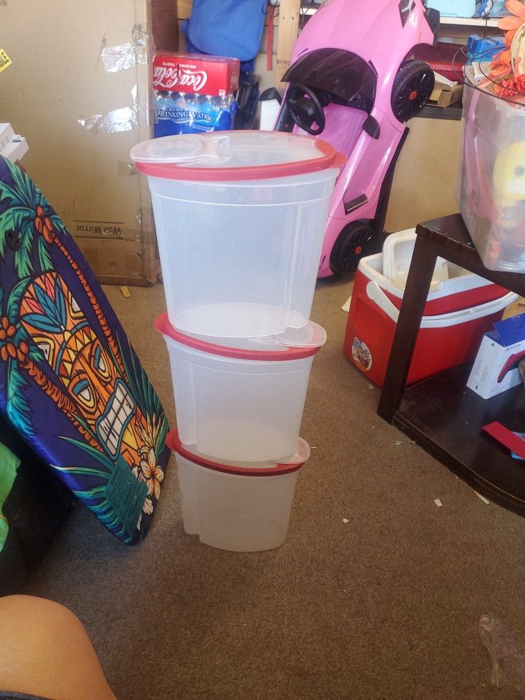 Set up 3 Rubbermaid storage containers