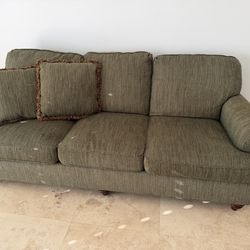 Olive Green Couch with two throw pillows