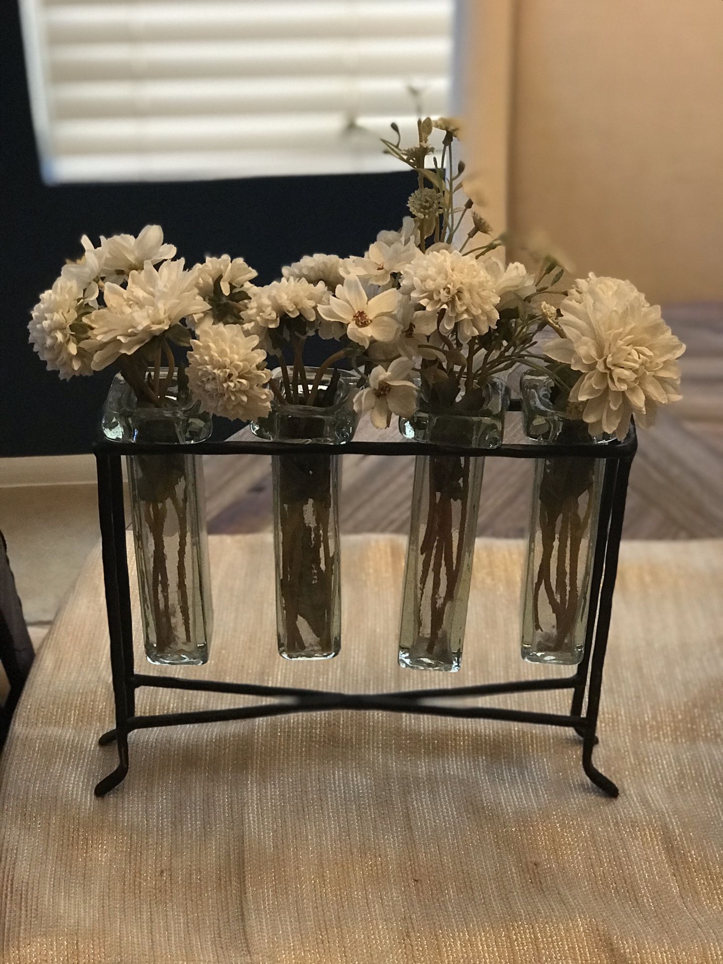 Home Decor. 4 glass and metal vase stand with flowers.
