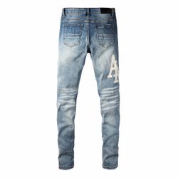 Amiri Light Wash Skinny Jeans with Logo Patch