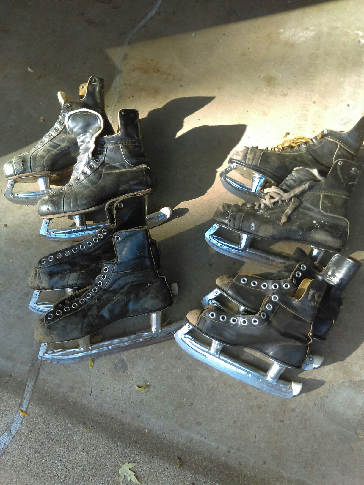 4 pairs of vintage ice skates