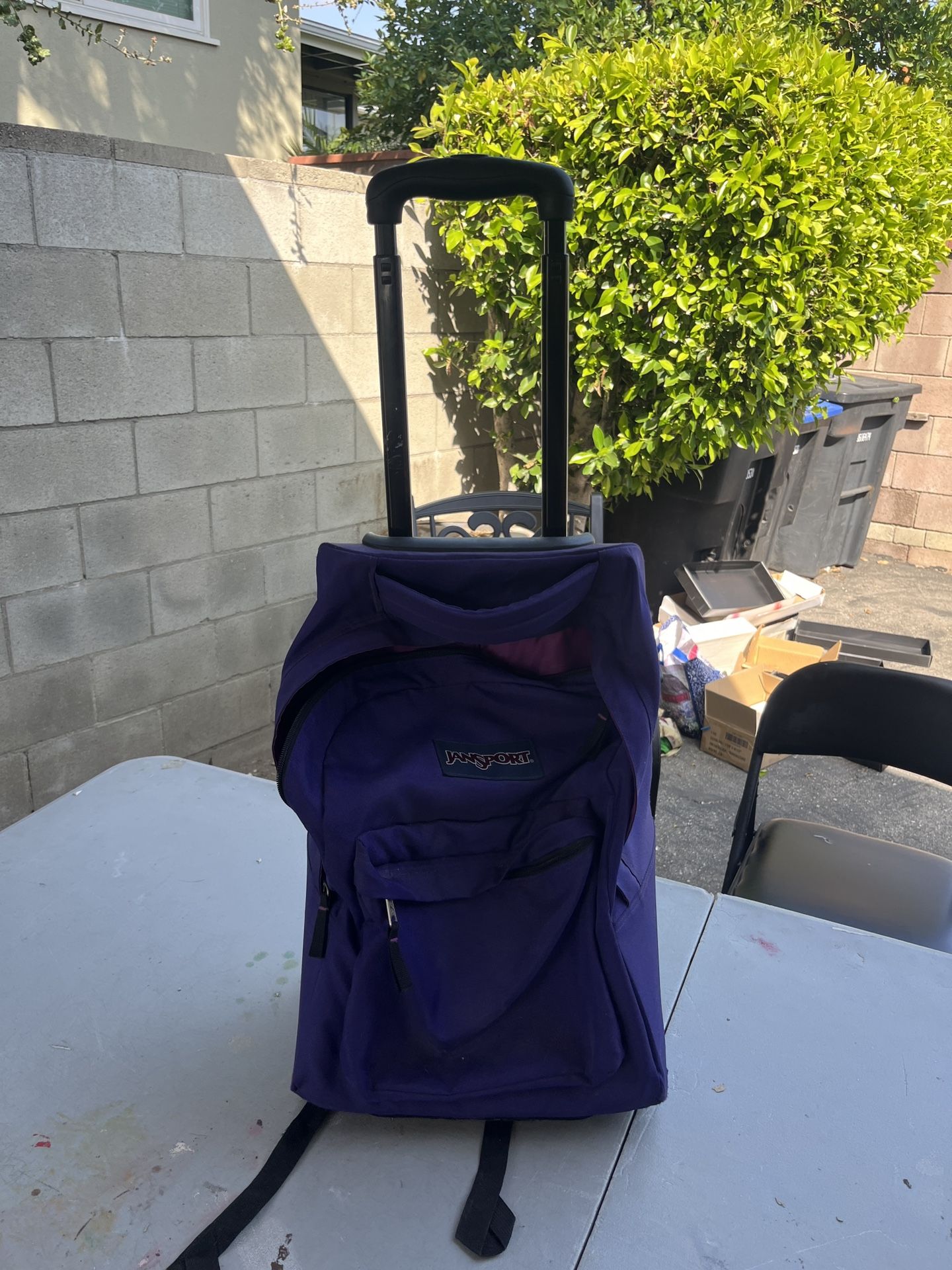 Used Purple Jansport Rolling Backpack