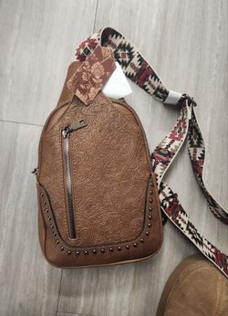 Crossbody Bag ,Boho-western style. It is new and stylish, never used with all the tags.