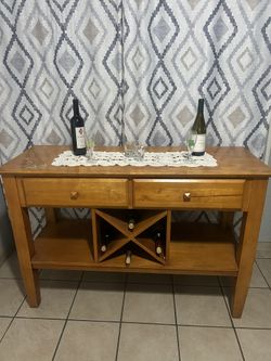 A brown 2 Drawer Wood Side Board 52Wx20Dx35