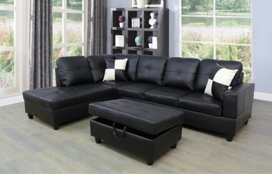 Black leather sectional couch and ottoman