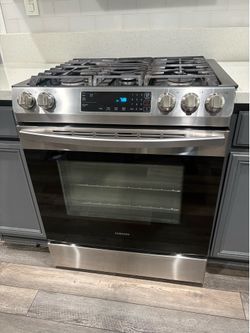 Gas range with oven slide in