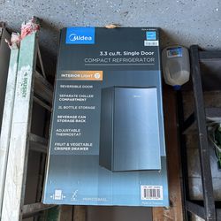 New, 3.3 cubic foot refrigerator