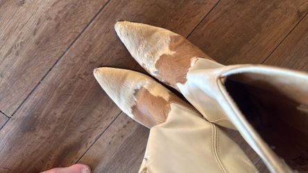 Western boots with hair on them.
