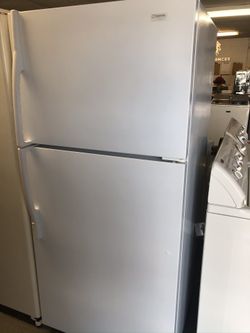 Used Maytag top and bottom fridge. 1 year warranty