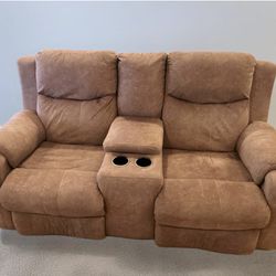 Brown Reclining Love Seat With Center Console.