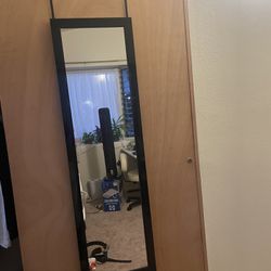 Over door black trimmed hanging mirror