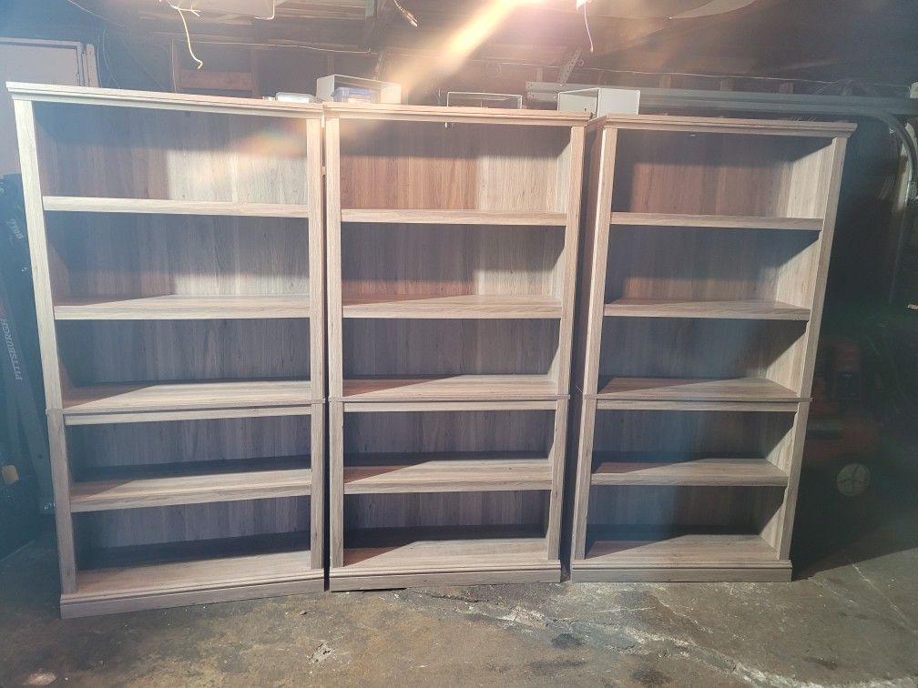 SET OF 3 BOOKCASES WITH 4 SHELVES EACH IN DECENT CONDITION. GREAT FOR HOME OFFICE OR ANY BUSINESS.  MEASUREMENTS ARE 70X12X35.$100.00 OR BEST OFFER. 