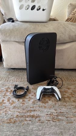 PlayStation 5 with D-Brand face plate and 1TB extra inside