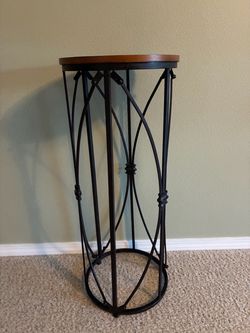 Black metal and brown wood plant stand