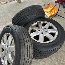 Set of 4 Yokohama AWD tires Mounted On Honda CR-V Rims.