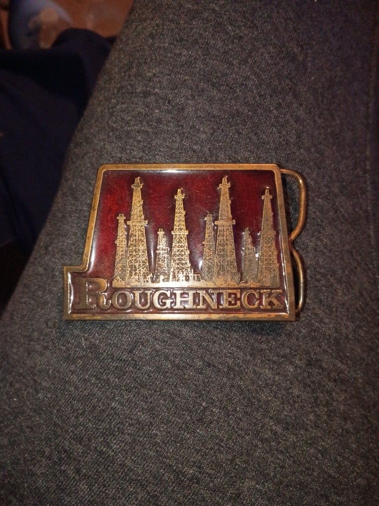 Old Oilfield Belt Buckle. Reads "Roughneck"