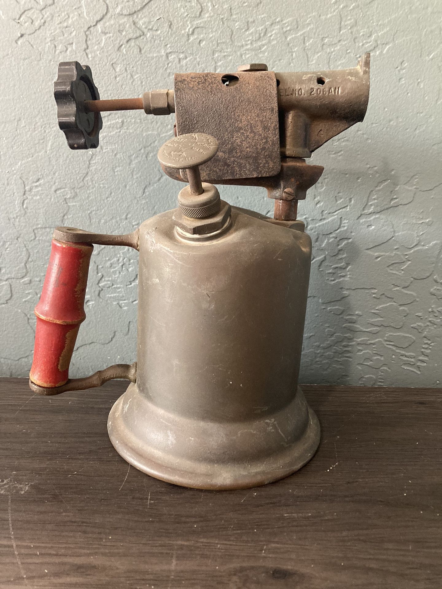 VINTAGE ANTIQUE “TURNER BRASS WORKS” BLOW TORCH. RED HANDLE. GREAT PATINA.