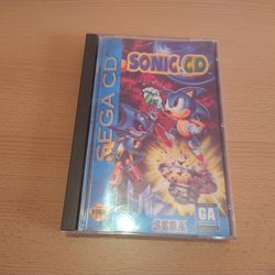Sonic CD (Sega CD, 1993) - Disc, case, and manual with registration card.