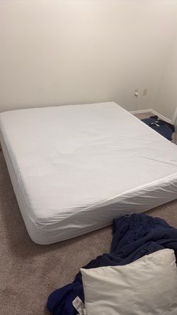 King Mattress with White Protector Cover
