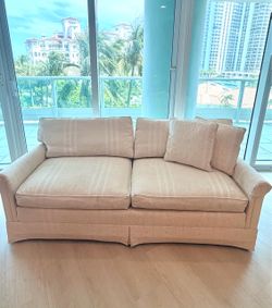 Elegant Off- White Sofa  and matching accent Pillows