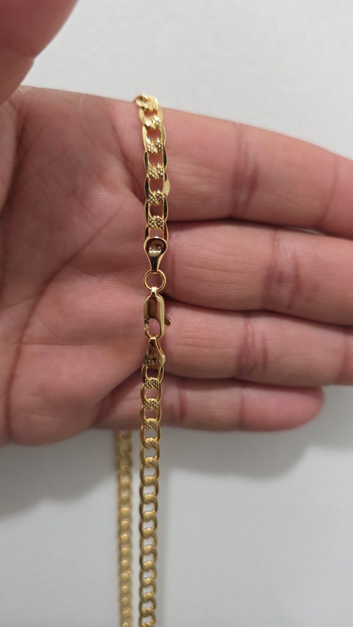 Used 22" 14k solid gold 17g cuban necklace.