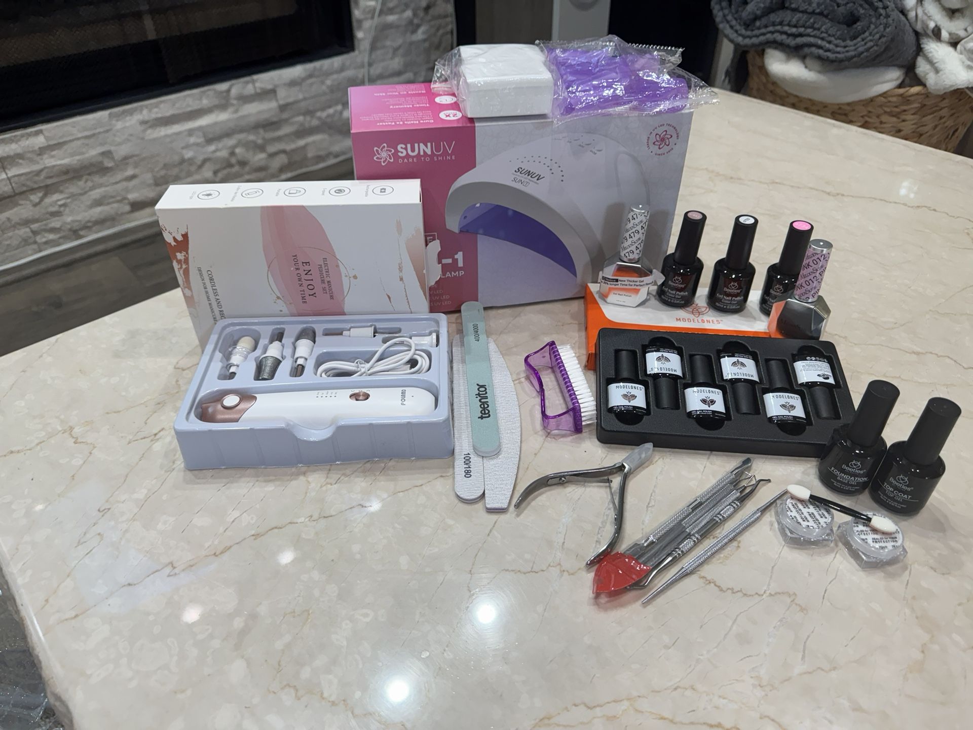 Gel Nail Set Includes UV Light Variety Nail Polish Colors. Asking $50