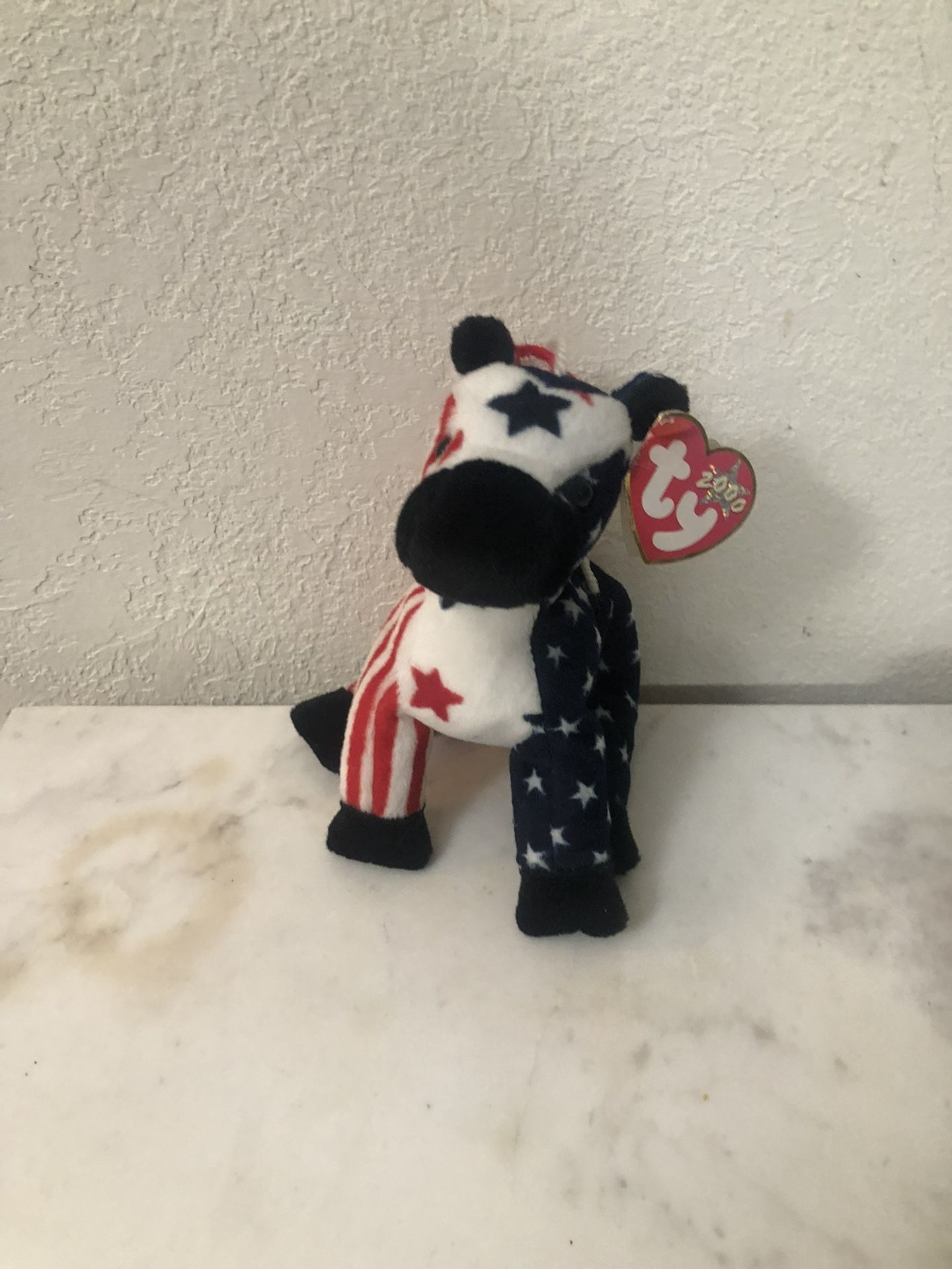Ty Beanie Babie “Lefty” 2000.  Size  7 inches tall.  Sits  up.  Brand New with Tags.  Has been on display in a cabinet with a Ty beanie Babie collecti