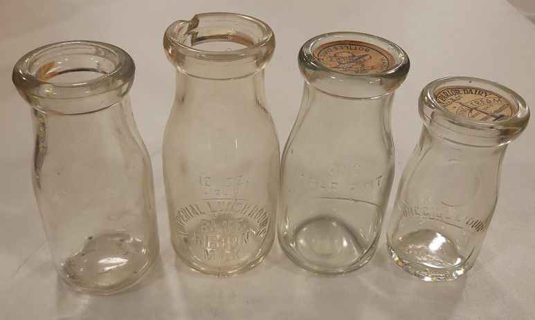4 Vintage Embossed Milk Bottles