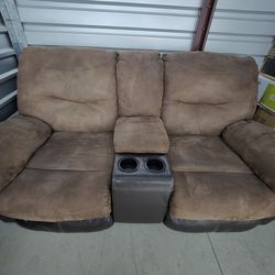 Suede and Leather Reclining Sofa.