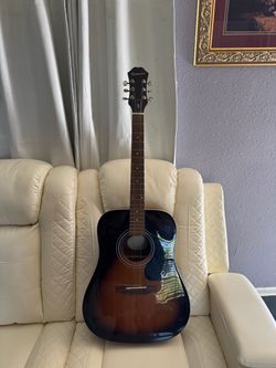 Selling an Epiphone guitar; it's missing two strings.