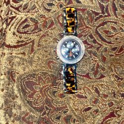 tortoise shell band geneva watch. 
