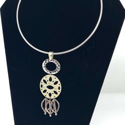 Silver tone silver choker necklace with tri-color pendant (silver, yellow and rose gold toned) & rhinestones.