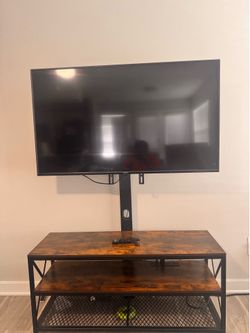 Vizio TV (55”) with Large TV stand with TV mount