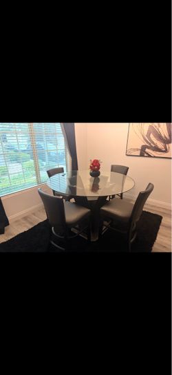 Glass dining table with chairs