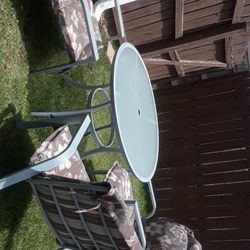 OUT DOOR DINING TABLE AND 3 CHAIRS  WITH CUSHIONS 